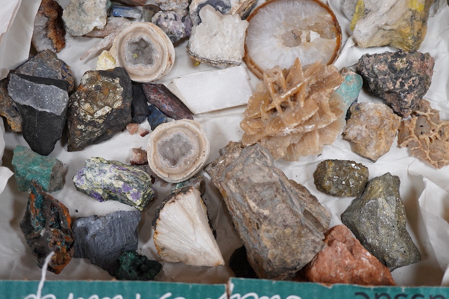 A collection of mineral and crystal samples, including large quartz segments and a good variety of other crystal formations